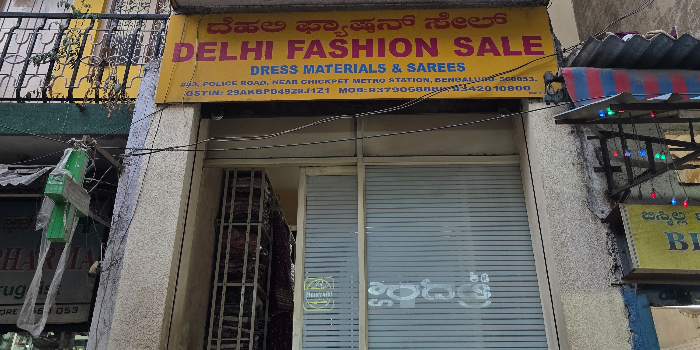 Banner DELHI FASHION SALE AND DRESS MATERIALS