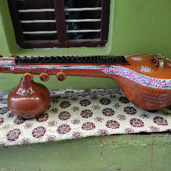 Saraswati Ekanda veena-https://media.vyaparify.com/vcards/products/152151/product_1740732546_67c17882aeb6f.png Image