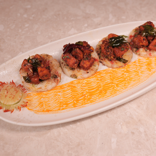Fiery Paneer Bites on Mini Uttapam-https://media.vyaparify.com/vcards/products/413740/product_1763194062_691834cebfe2b.png Image