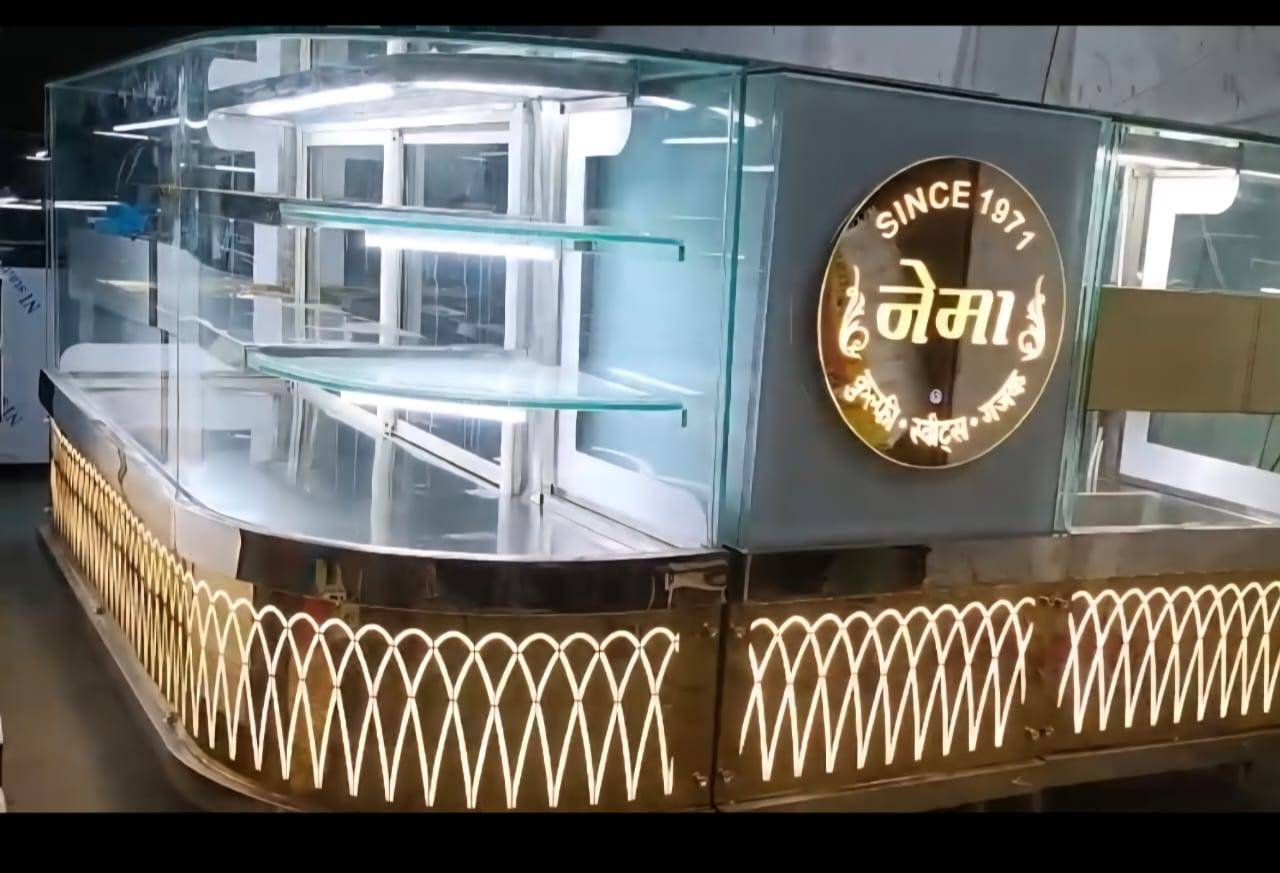 Nema Corner Display Counter in Daru Godam: Stylish Glass Enclosure with LED Lighting -  - Buy Online at MAHALAXMI STEEL FURNITURE