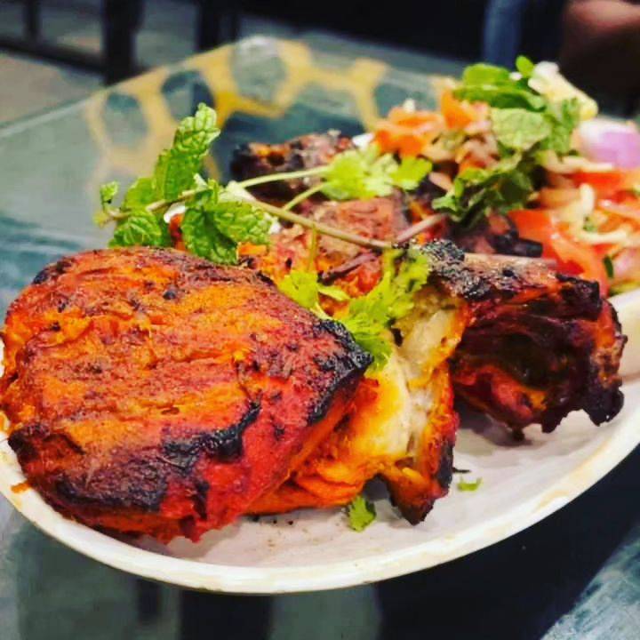Delicious Tandoori Chicken served in a 1kg pack from CBSE CAFE LINGASUGUR, Karnataka.