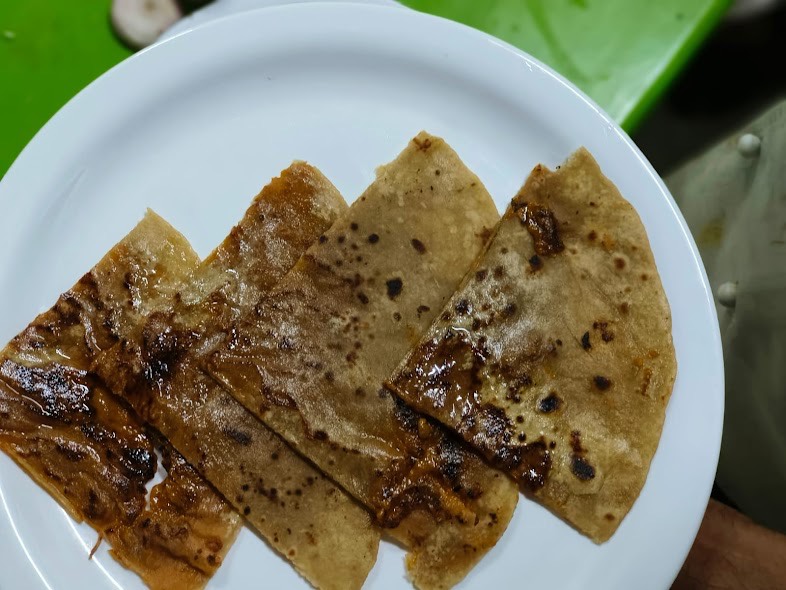 Khava Poli Sweet - Traditional Indian Delight - khava poli sweet in [location] - traditional indian dessert with rich khoya filling - Buy Online at HOTEL KOHINOOR PURE VEG RESTAURANT