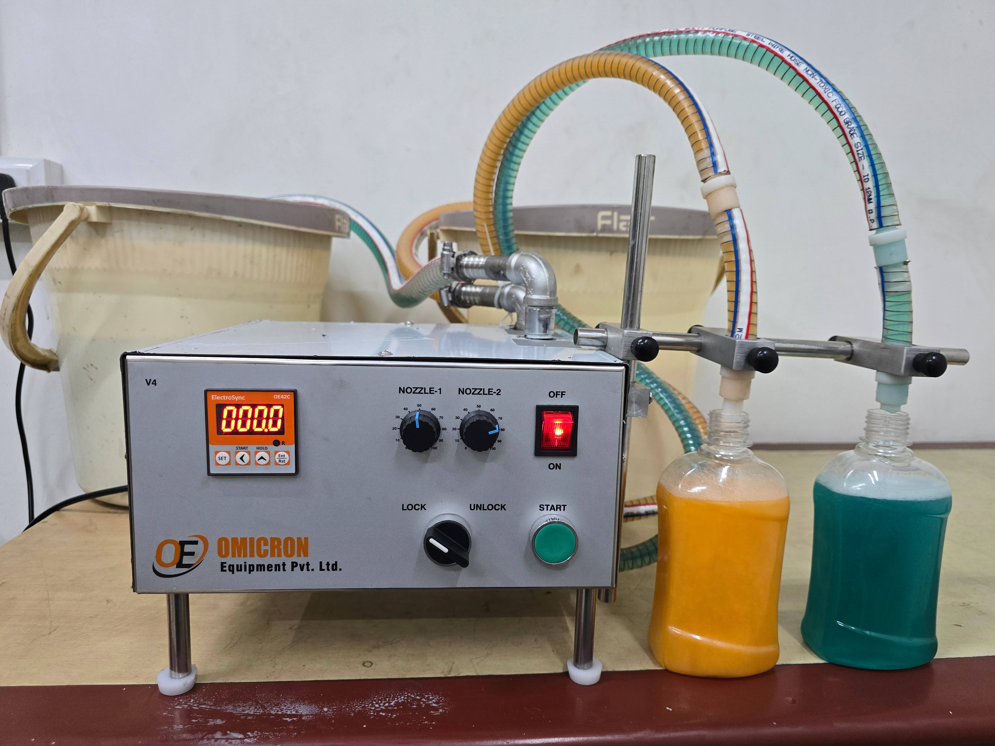 High Viscose Double Nozzle Liquid Filling Machine in Odhav Efficient Filling -  - Buy Online at OMICRON EQUIPMENT PVT LTD