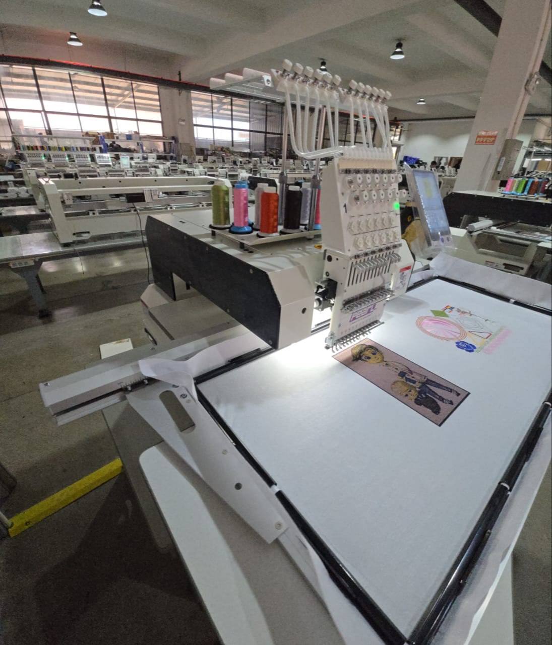 Robust multi-head embroidery machine designed for high-volume production, showcasing intricate textile designs, available at 