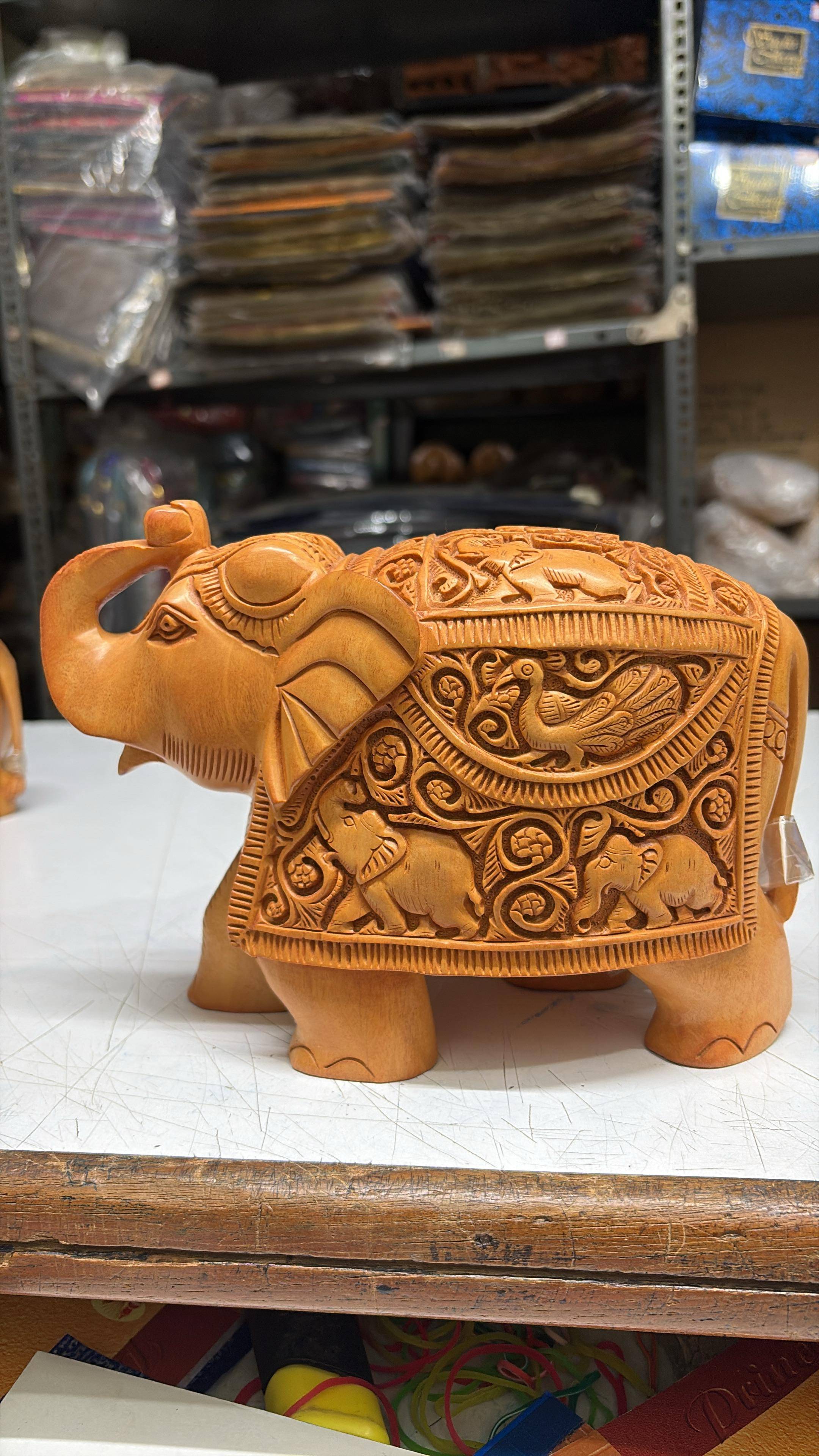 Wood Carving Master Carving Trunk Up Elephant in Bengaluru - Handcrafted Elegance -  - Buy Online at CAVERY COTTAGE EMPORIUM