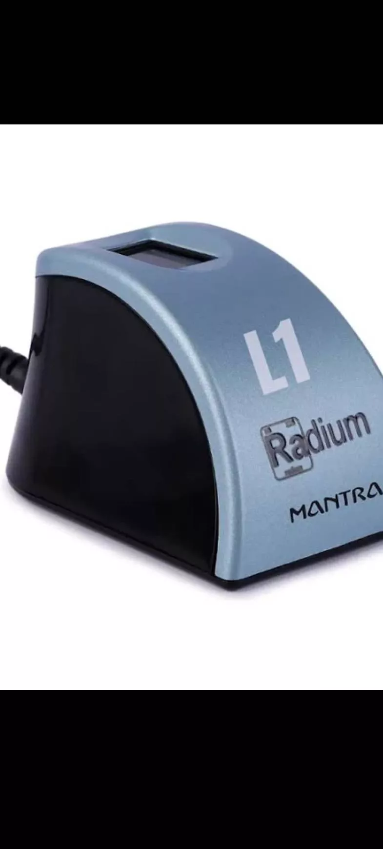 Mantra L1 Fingerprint Scanner displayed on a desk with a user placing their finger for scanning in ETAWAH.