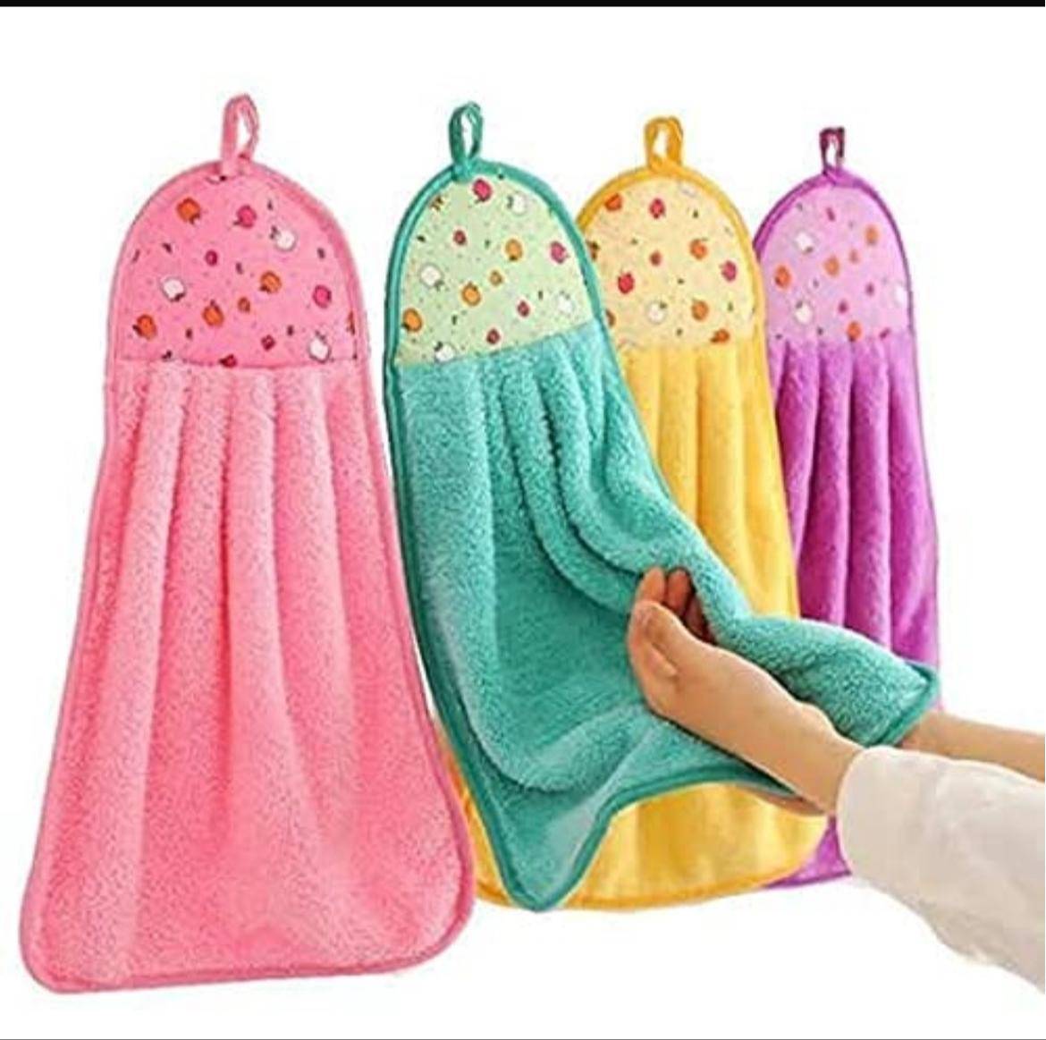 Colorful hanging hand towels with loops for easy access, offering absorbency and style, available at NOOR ENTERPRISES in Sola