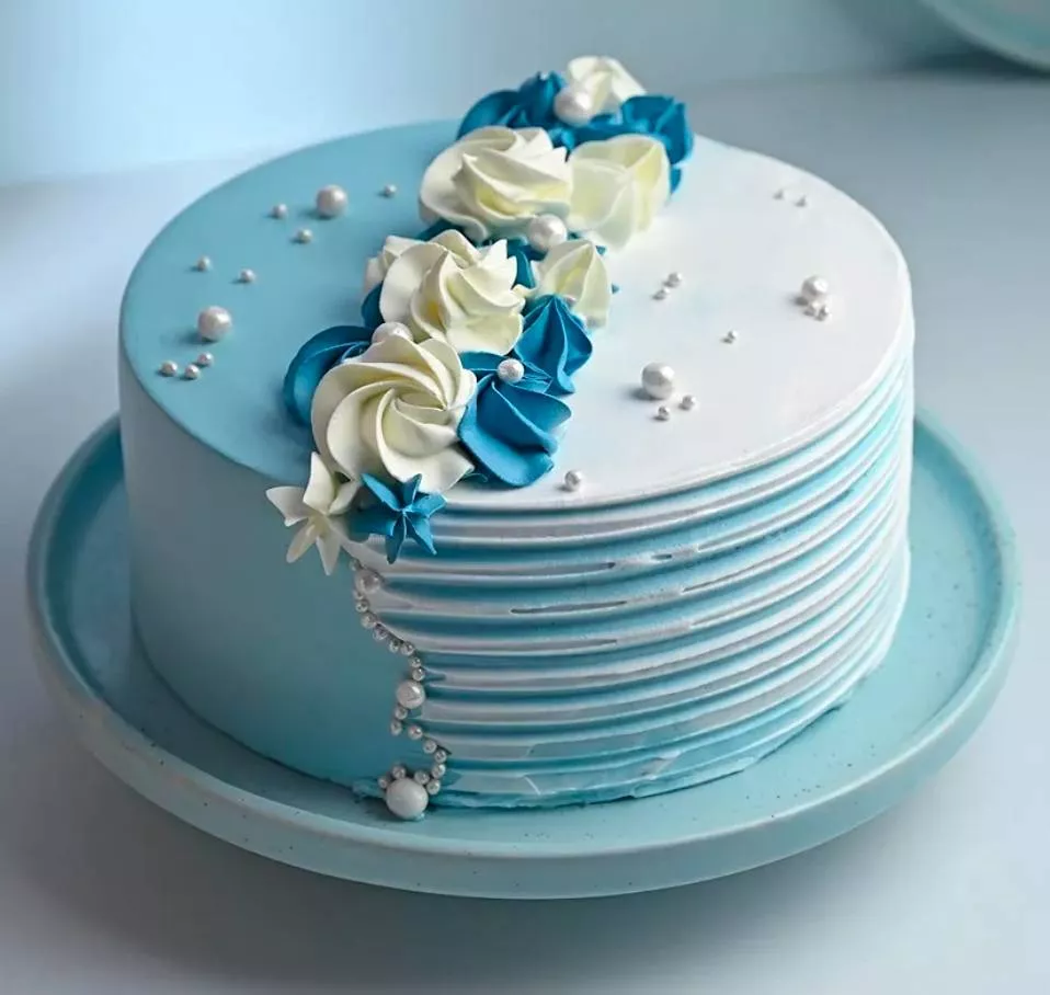 Stunning blue and white floral cake decorated with elegant flowers, available at 9 ELEVEN SUPER MARKET in Palwancha