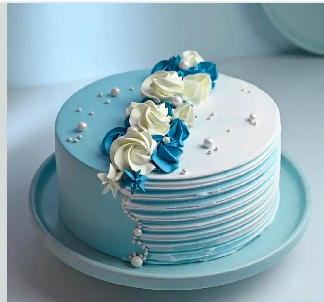 Stunning Floral Cake - Blue Elegance in 10, decorated with intricate blue flowers, perfect for celebrations in KHAMMAM.