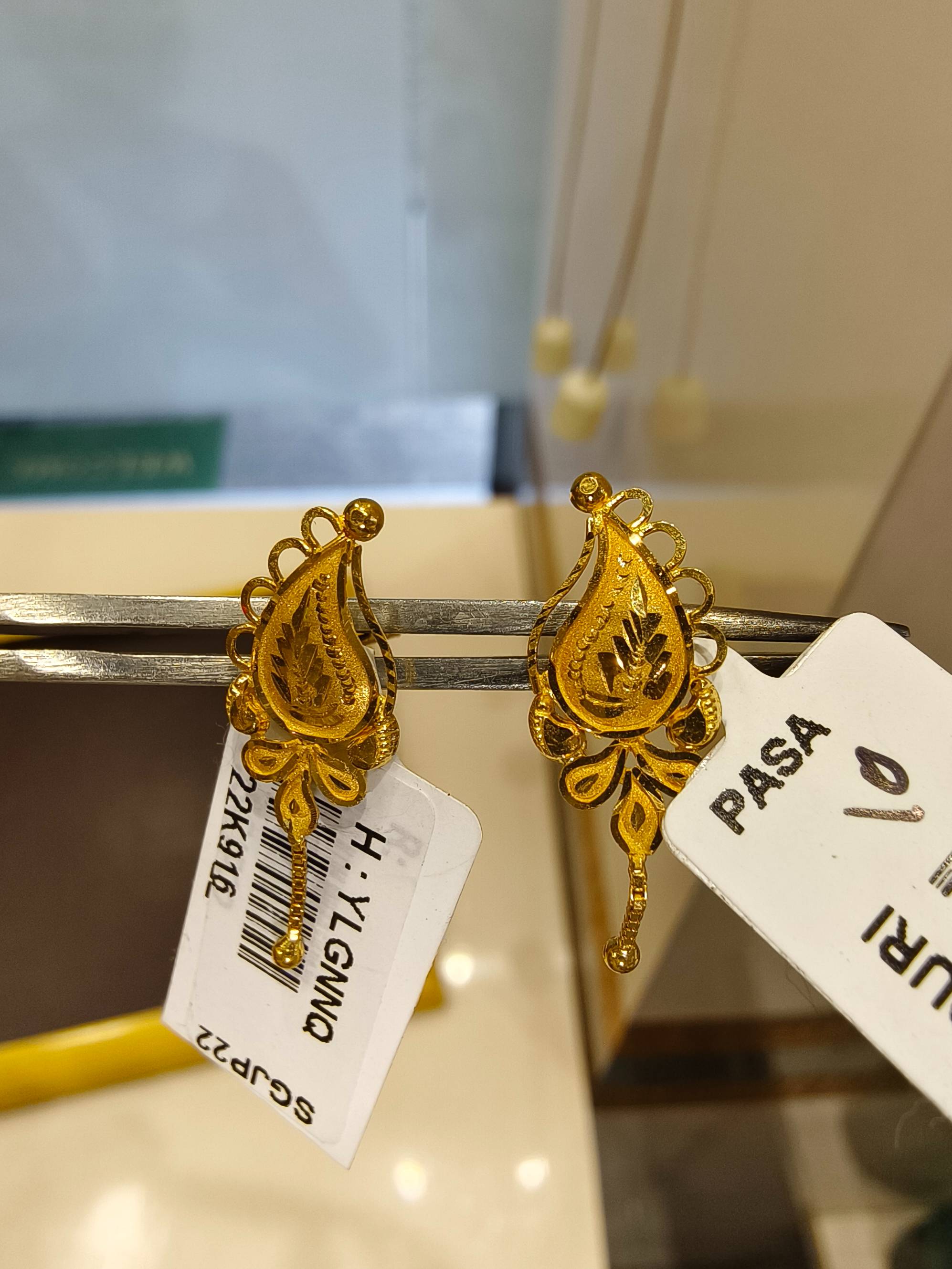 Elegant Gold Earrings designed to elevate style, showcasing intricate craftsmanship in TWENTYFOUR NORTH PARGANAS.