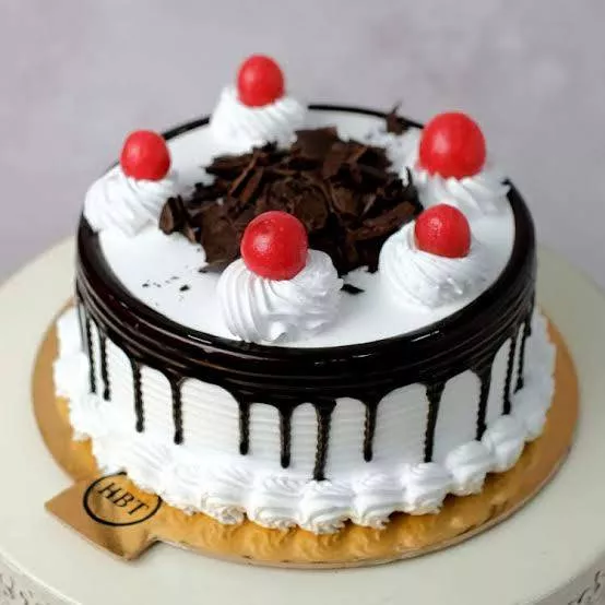 Rich and decadent Black Forest Cake with layers of chocolate and cherries at SIDHWAN NURSERY FARM in GHUMAN