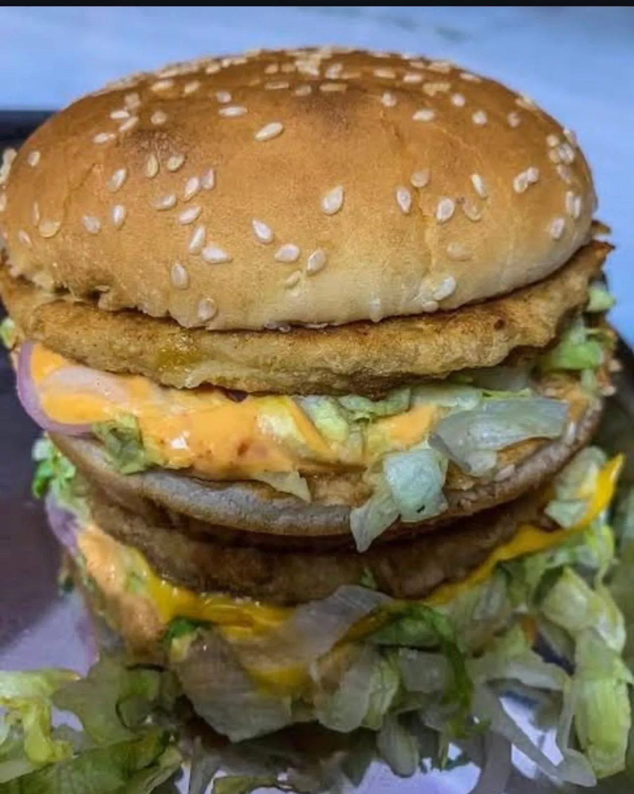 Delicious double crispy Veg Burger from SANGAM SWEET SHOP in HOSHIARPUR, featuring fresh ingredients and a golden crispy bun.