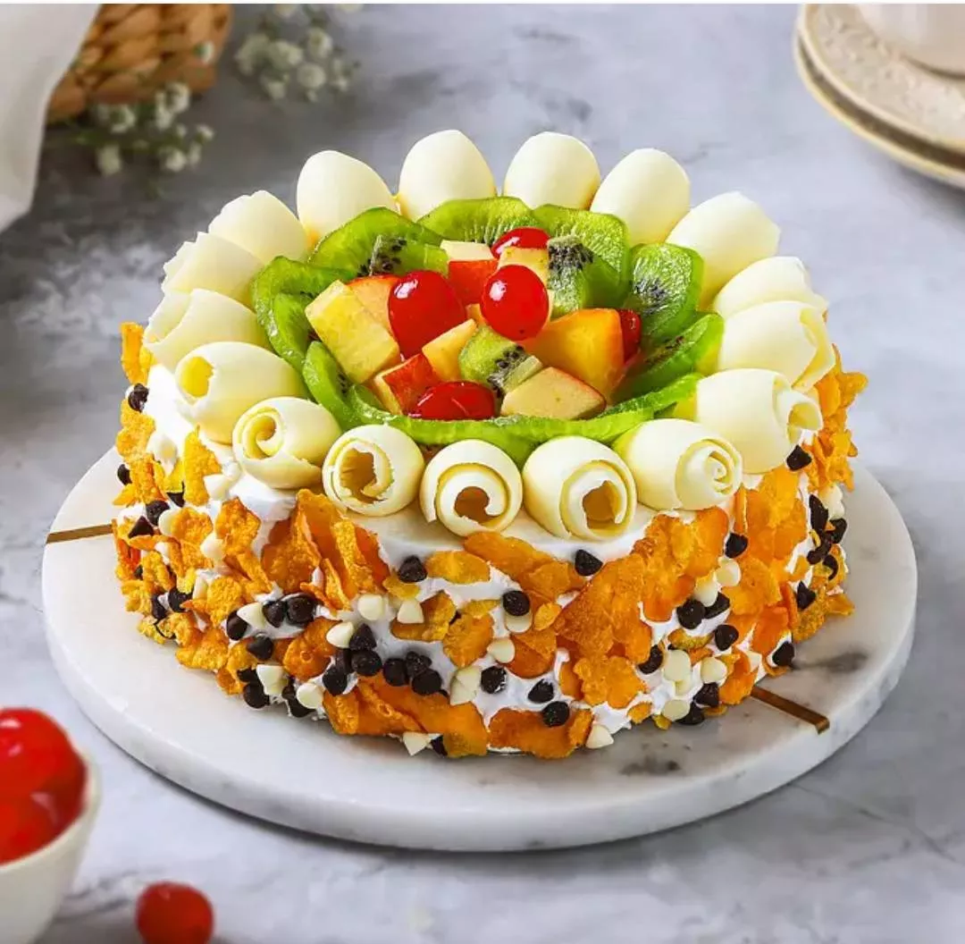 Exotic Fruit & Cream Cake topped with fresh fruits and creamy frosting in Kapurthala, showcasing vibrant colors and textures.