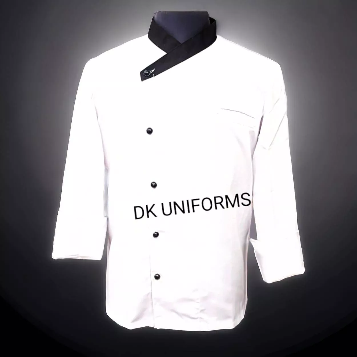 Professional chef coat with black trim designed for culinary experts in Delhi, featuring a comfortable fit and durable fabric