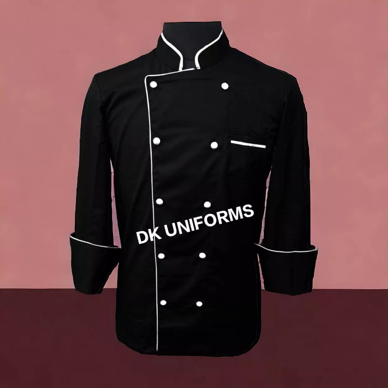 Stylish black chef coat with white buttons designed for professionals in Delhi, featuring a comfortable fit and elegant look.