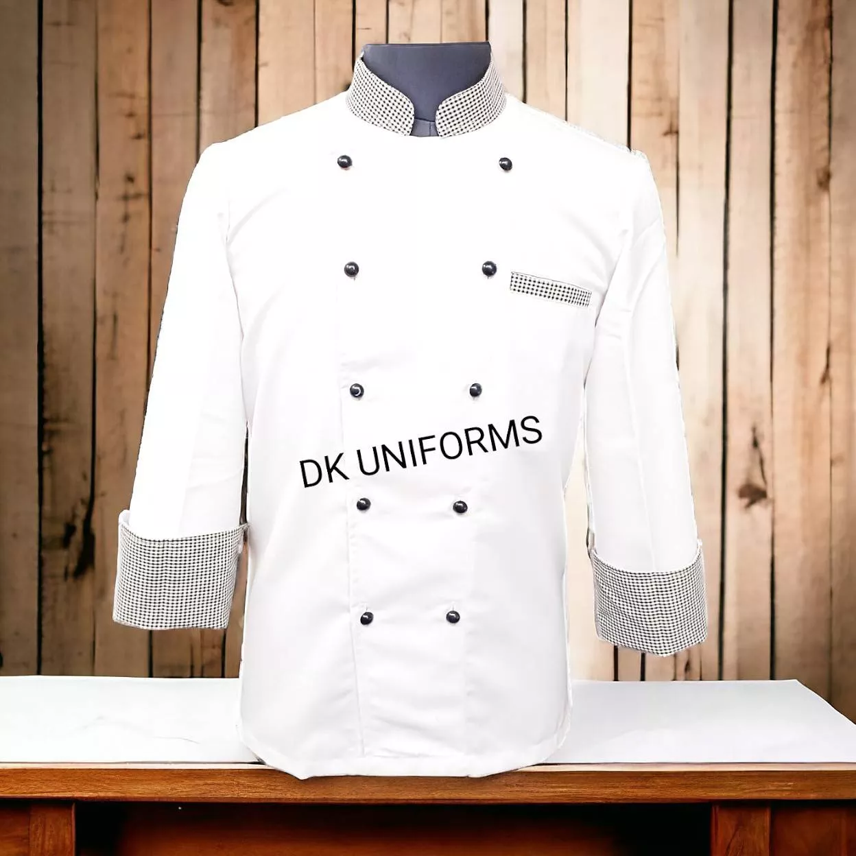 High-quality chef coat with checkered details designed for professional chefs in New Delhi, showcasing durability and style.