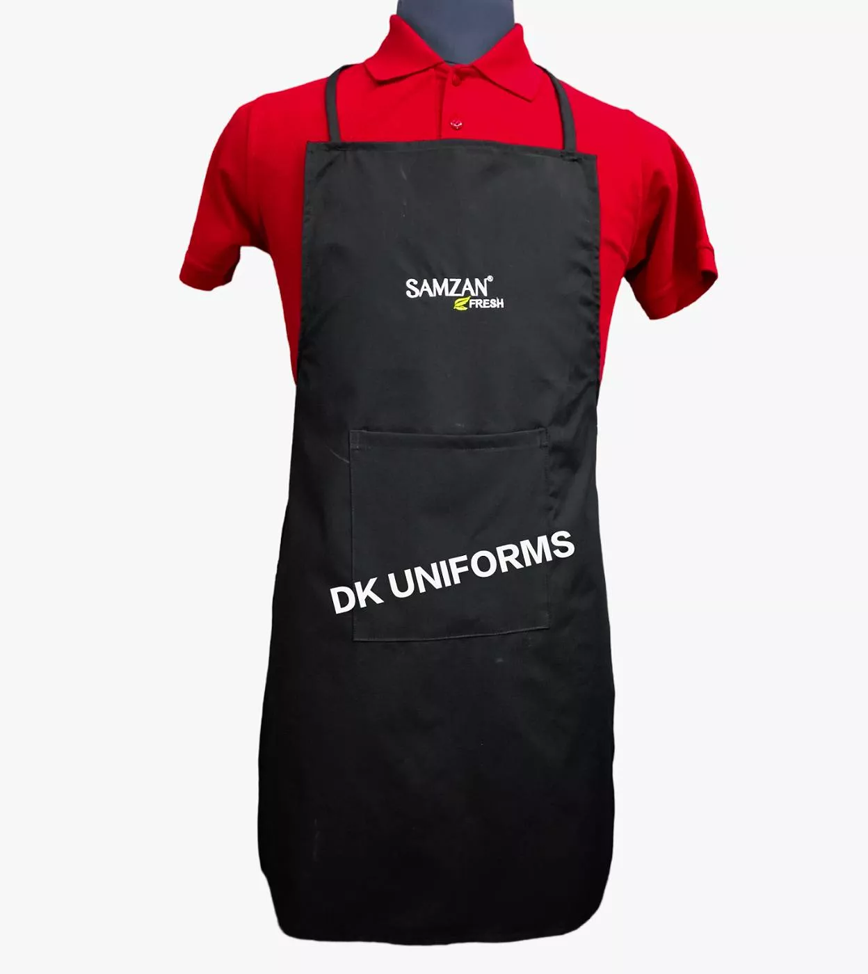 Durable black kitchen apron with front pocket, designed for both home and commercial use, from D K UNIFORMS, Delhi.