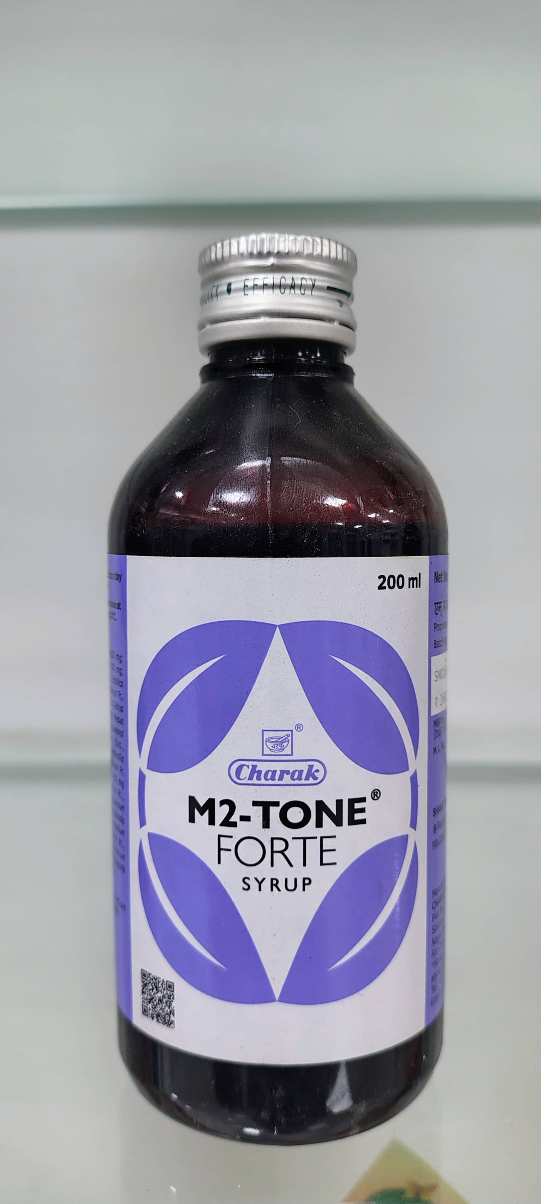Ayurvedic Syrup: Charak M2-TONE Forte Syrup designed for women's health support, displayed in Mocha with a natural herbal loo