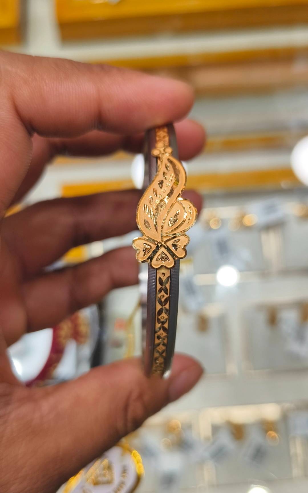 Elegant Jewelry/Gold-capped Loha Badhano featuring intricate designs and a luxurious gold finish, available at SHIV GOURI JEW