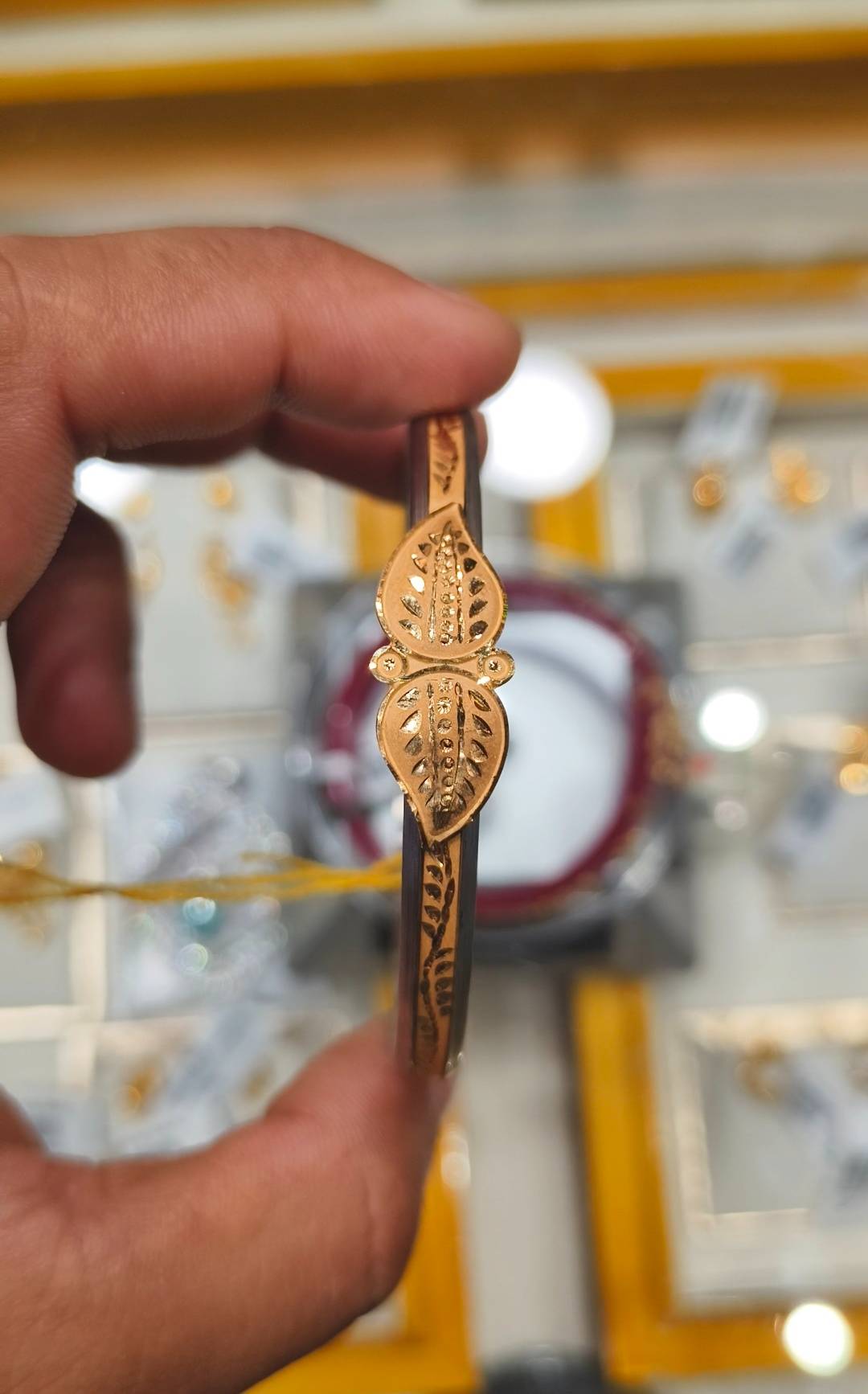 Elegant Jewelry/Gold-capped Loha Badhano featuring intricate designs and a luxurious gold finish, available at SHIV GOURI JEW