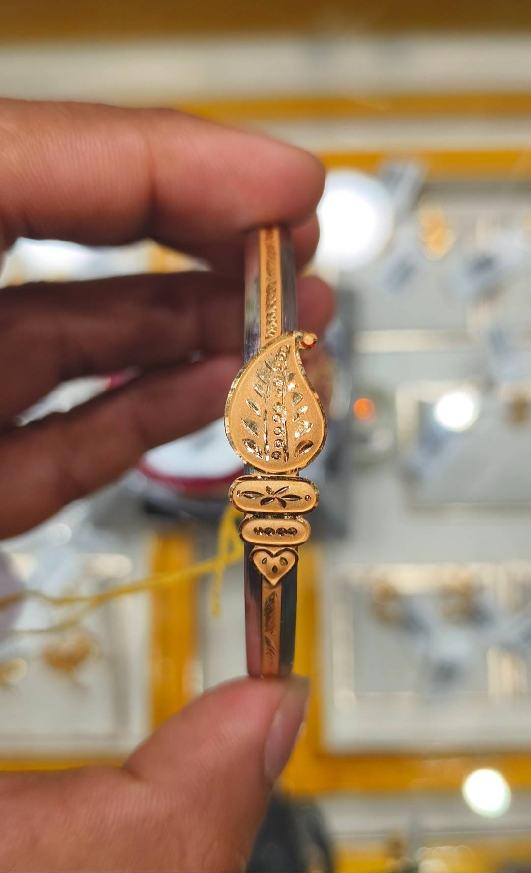 Elegant Jewelry/Gold-capped Loha Badhano featuring intricate designs and a luxurious gold finish, available at SHIV GOURI JEW