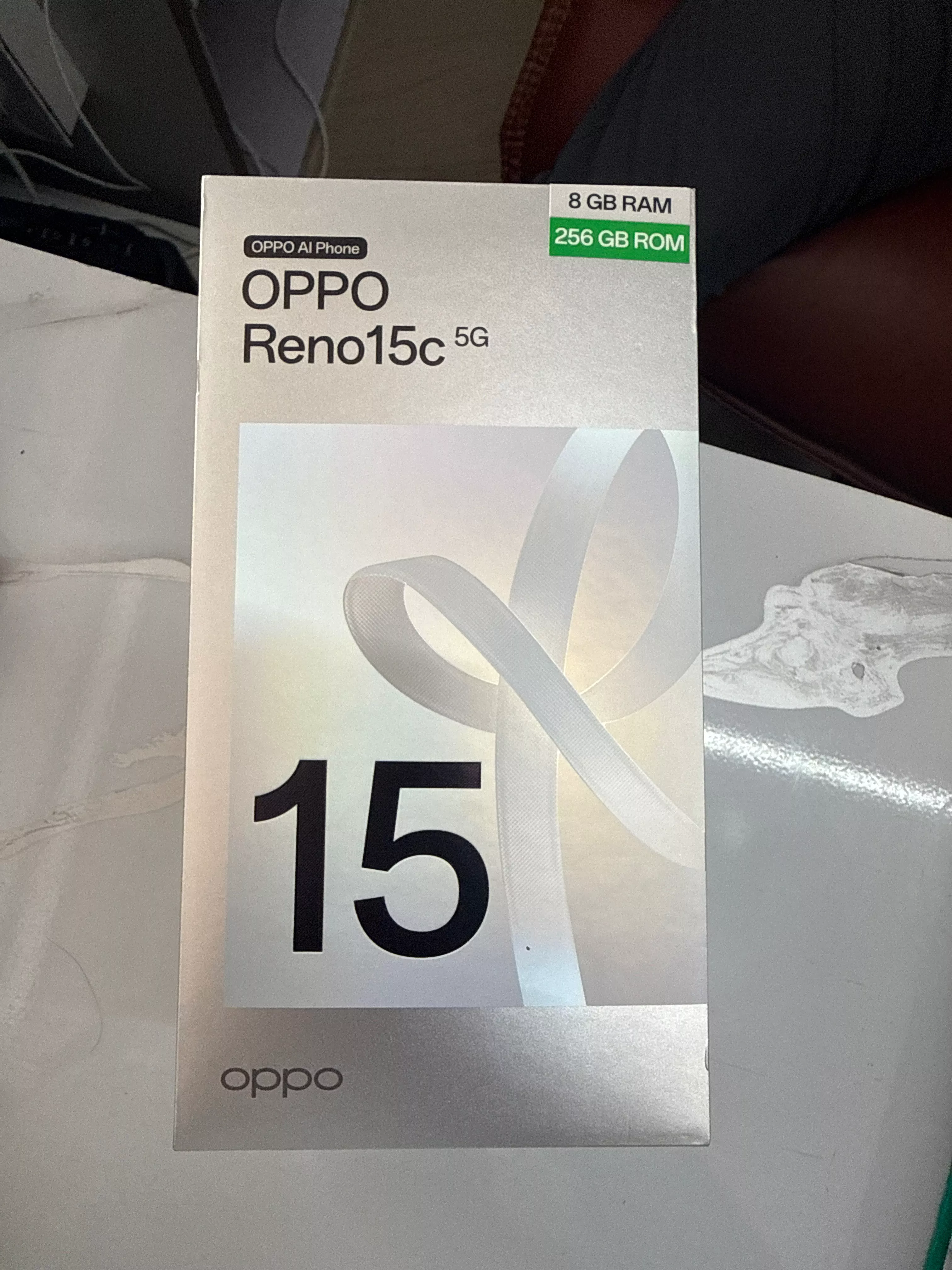 Oppo Reno 15C smartphone displayed on a clean surface showcasing its sleek design and features — Oppo Reno 15C in NAGAON