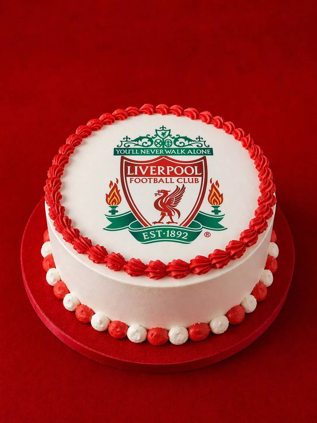 Liverpool Football Club themed cake featuring red and white frosting with the club's logo, perfect for fans in Bangalore