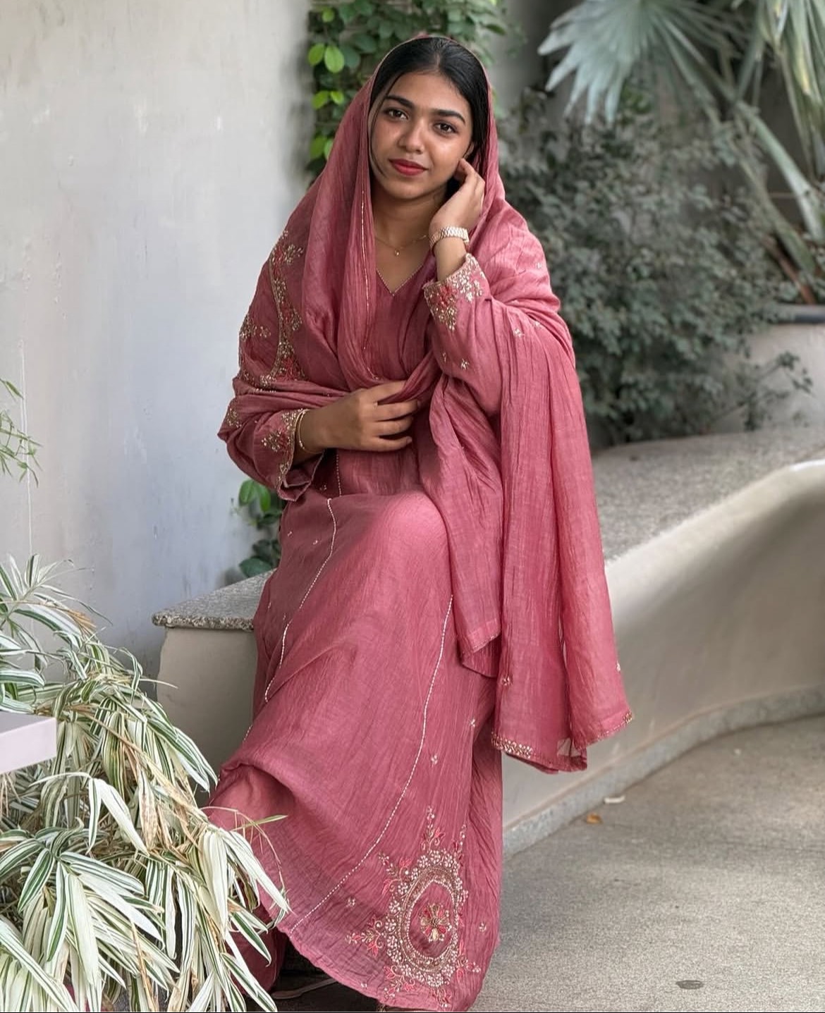 Elegant pink salwar kameez with intricate embroidery displayed in MULAWWAN store in Kozhikode, showcasing its exquisite desig