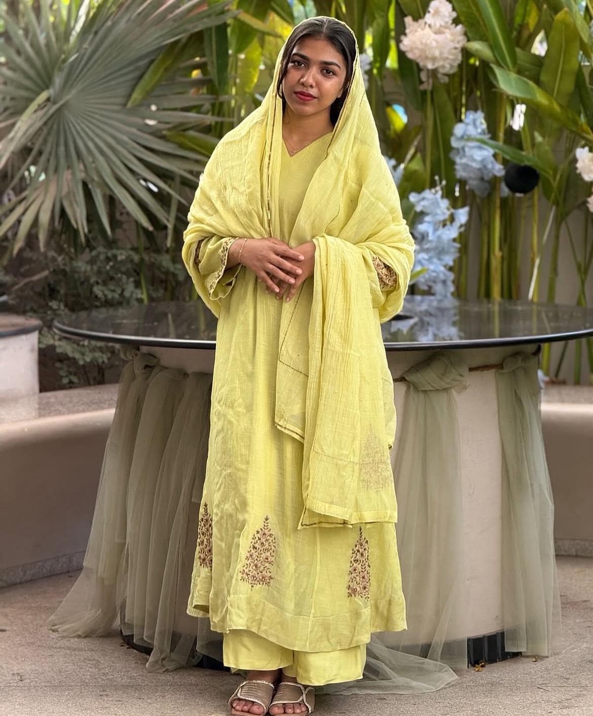 Vibrant lemon yellow embroidered salwar suit on a mannequin, showcasing intricate patterns and elegant design — Embroidered L
