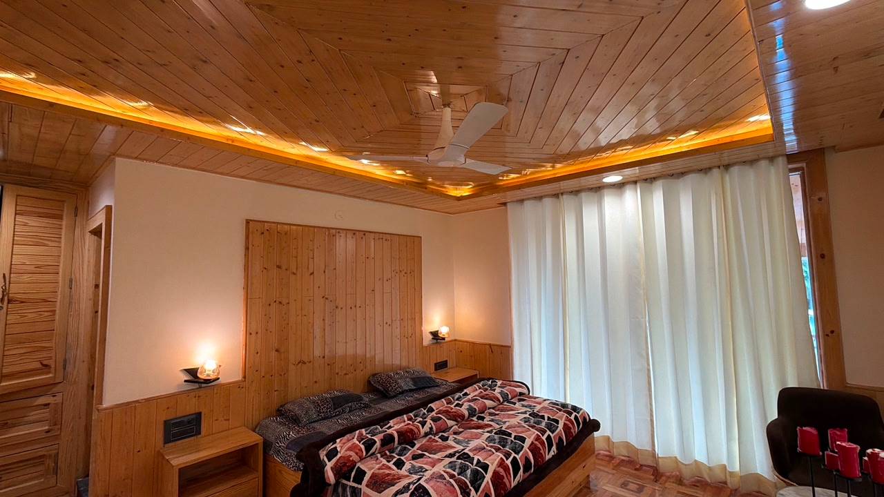 Elegant wooden ceiling and wall paneling showcasing rich textures and finishes in a luxurious setting at OAK AMBER RETREAT, M