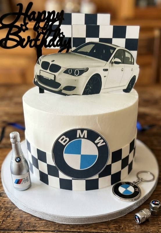 BMW themed birthday cake featuring an edible car design and logo in Bangalore, beautifully decorated and ready for celebratio
