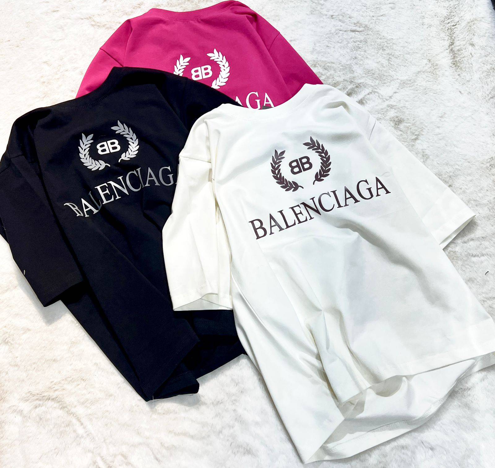 Stylish Balenciaga Logo T-Shirt Set in Kharar featuring black, white, and pink signature logo tees that enhance any wardrobe.