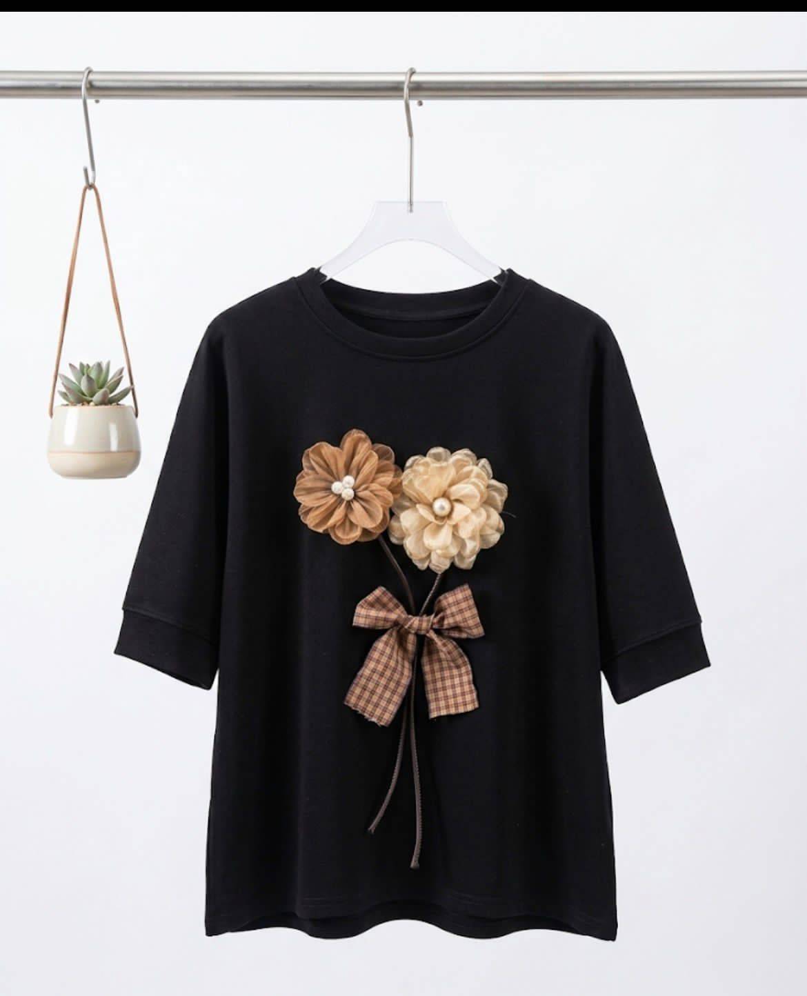 Black t-shirt with floral embellishments and bow accent from Kritika Fashion in Kharar, stylish and elegant design