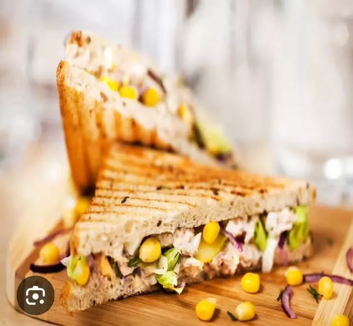 Grilled sweet corn sandwich with fresh vegetables, showcasing vibrant colors and a satisfying texture at FOUR 10 CAFE in BHAW