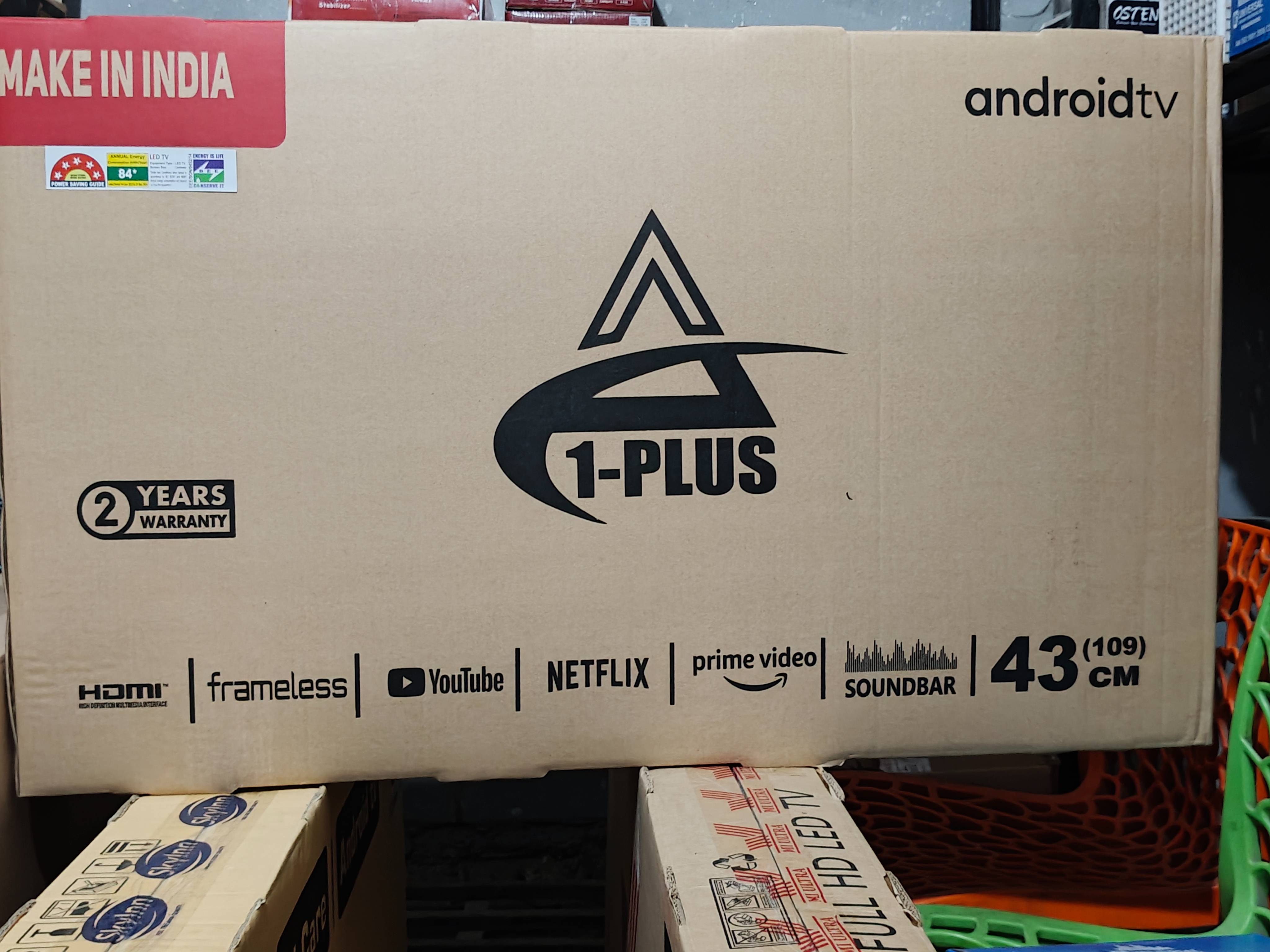 1-PLUS 43-inch Android TV showcasing a sleek design and integrated soundbar for enhanced multimedia streaming experience, loc