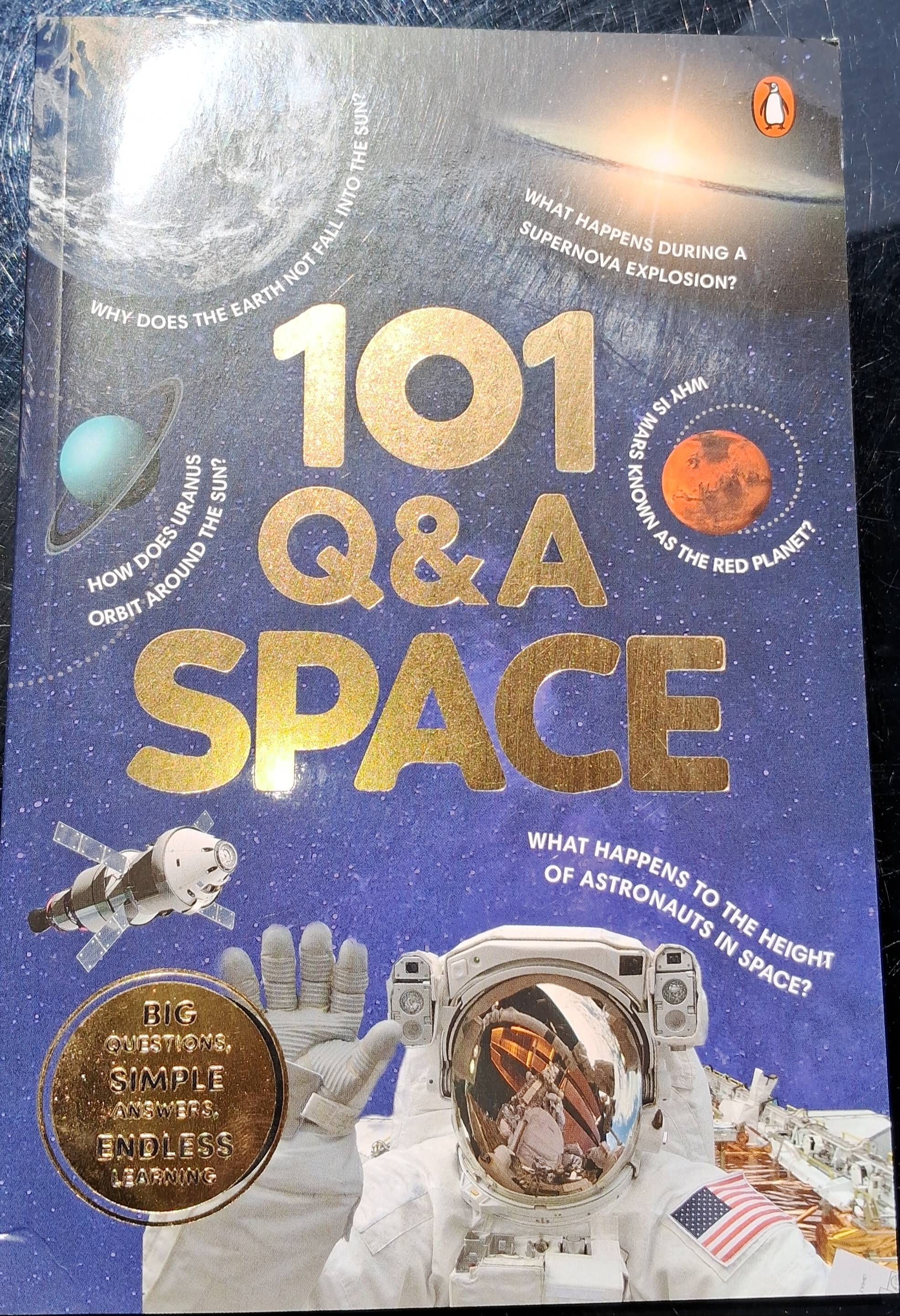 Detailed book cover of Space Exploration: 101 Q&A About Space featuring illustrations of celestial bodies, available in Luckn