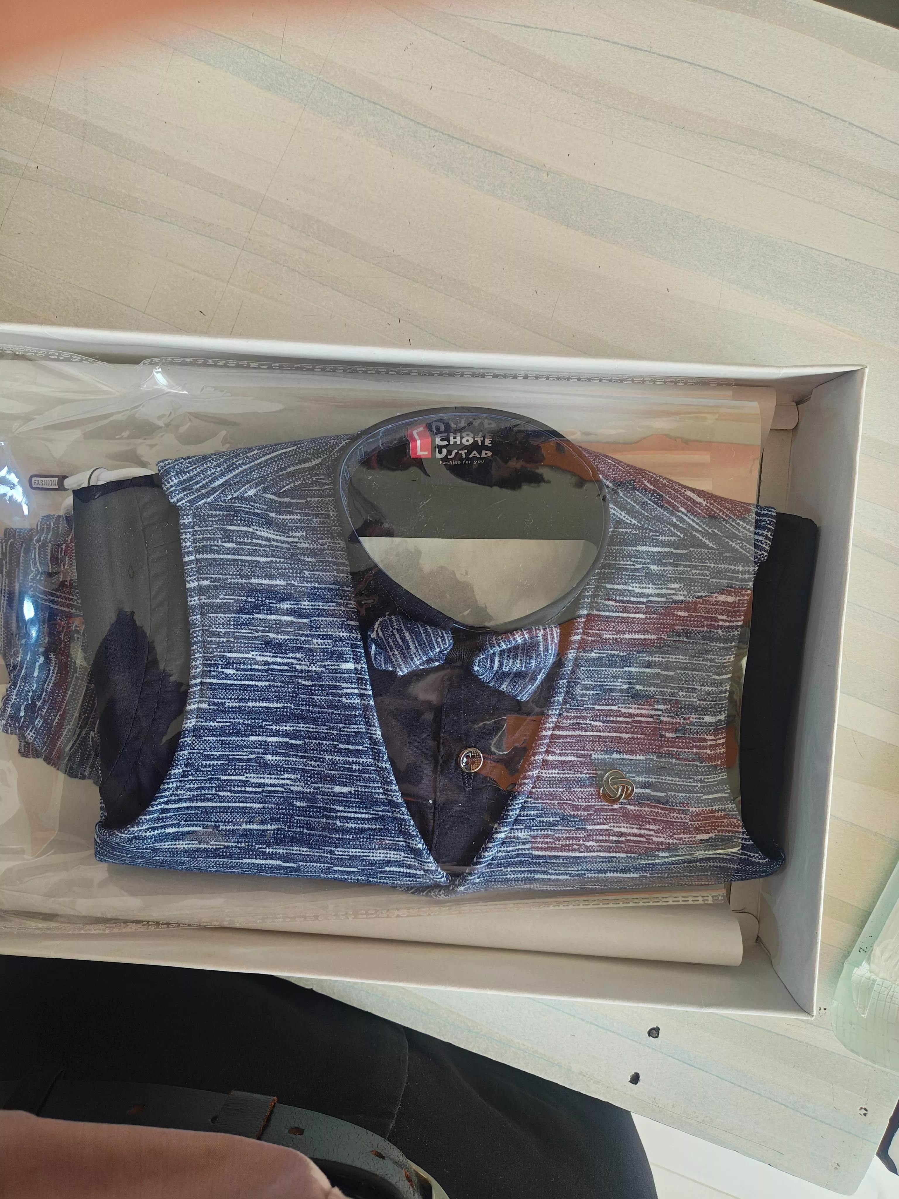 Kids' formal outfit set featuring a crisp shirt, smart vest, and matching bow tie, ideal for elegant occasions, available in 
