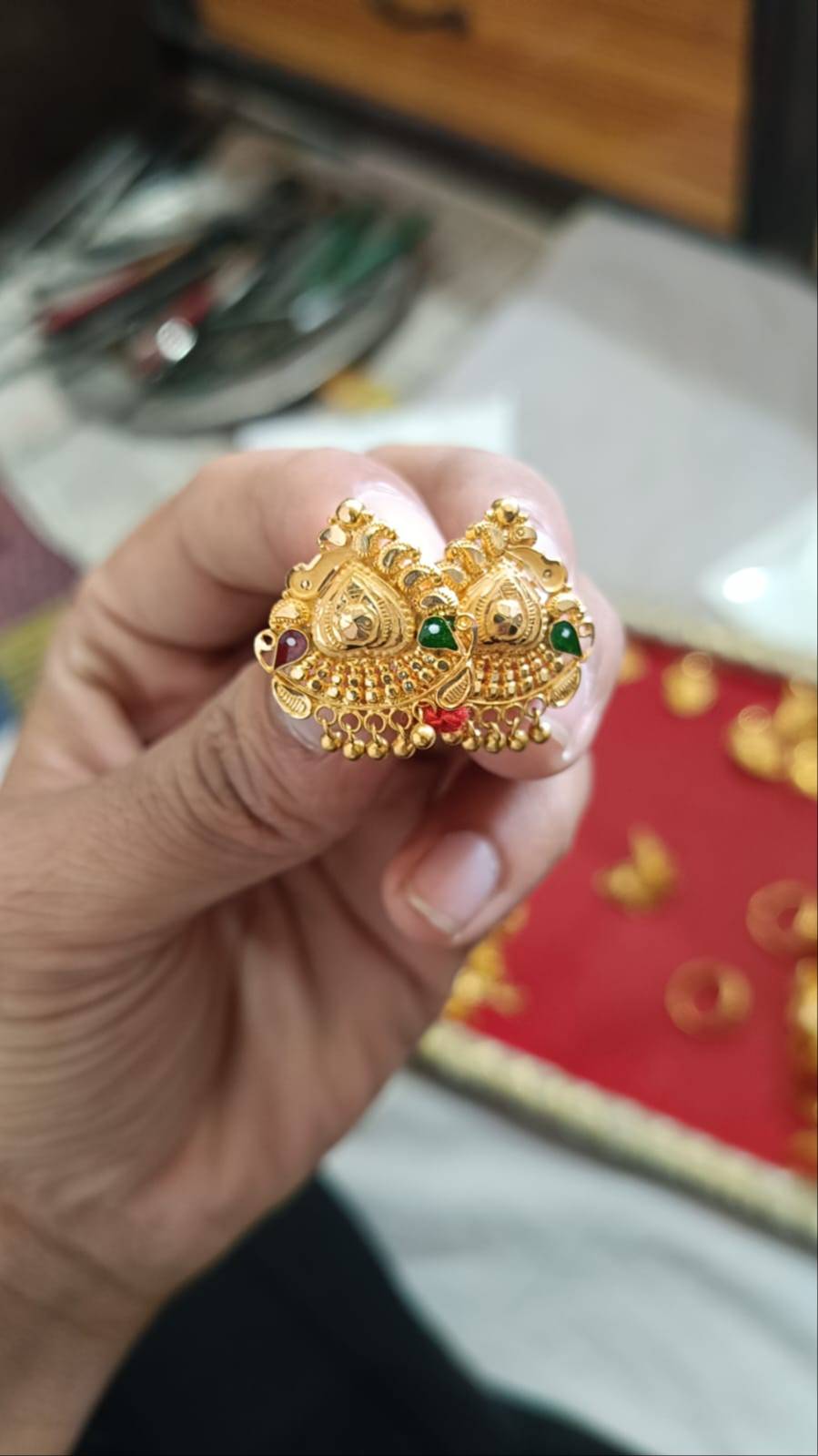Exquisite gold-plated jhumka earrings adorned with colorful stones, showcasing intricate design details, located in GYANPUR.