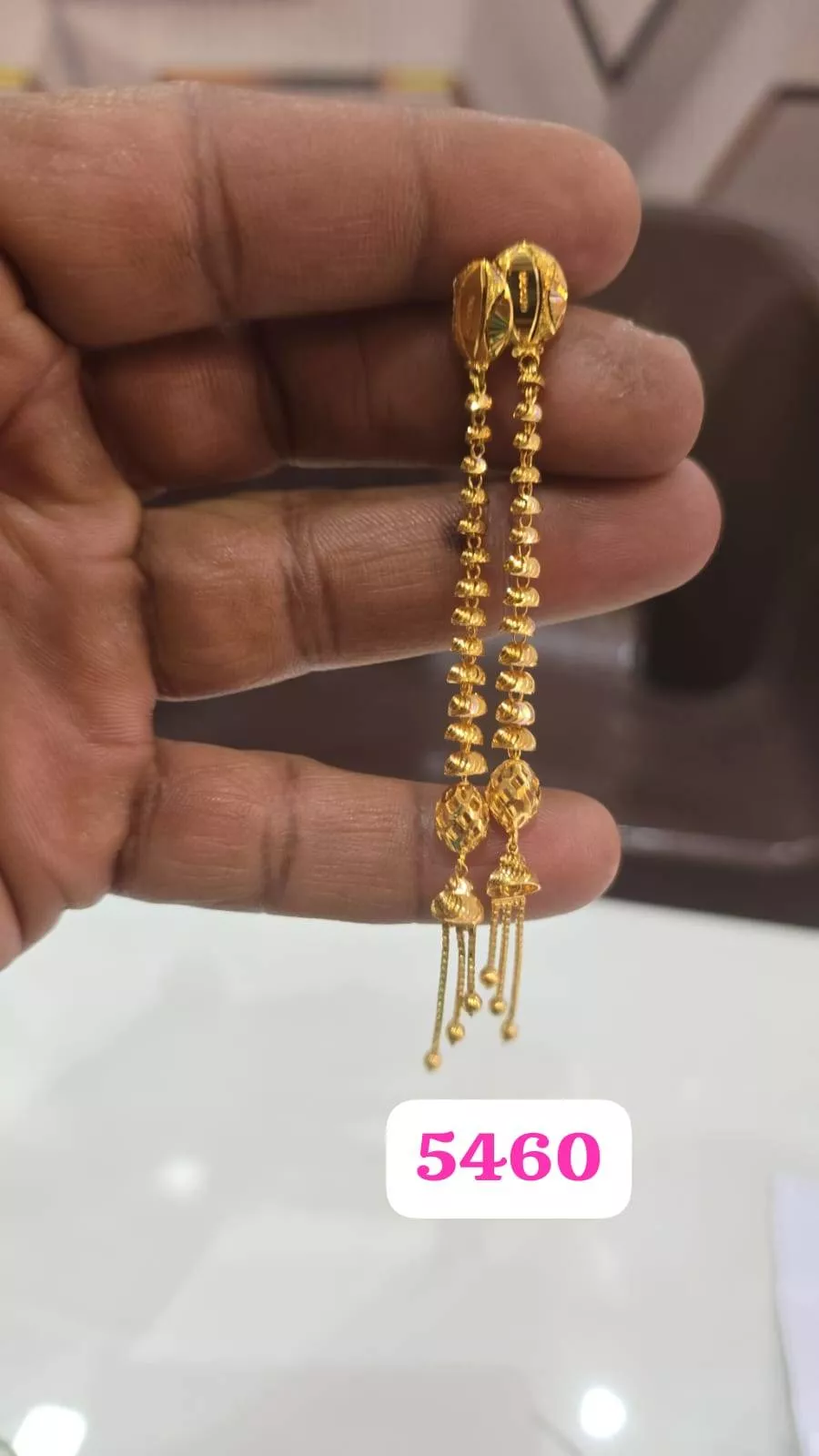 Traditional Gold Plated Jhumka Earrings showcasing intricate designs and elegant gold finish — GYANPUR