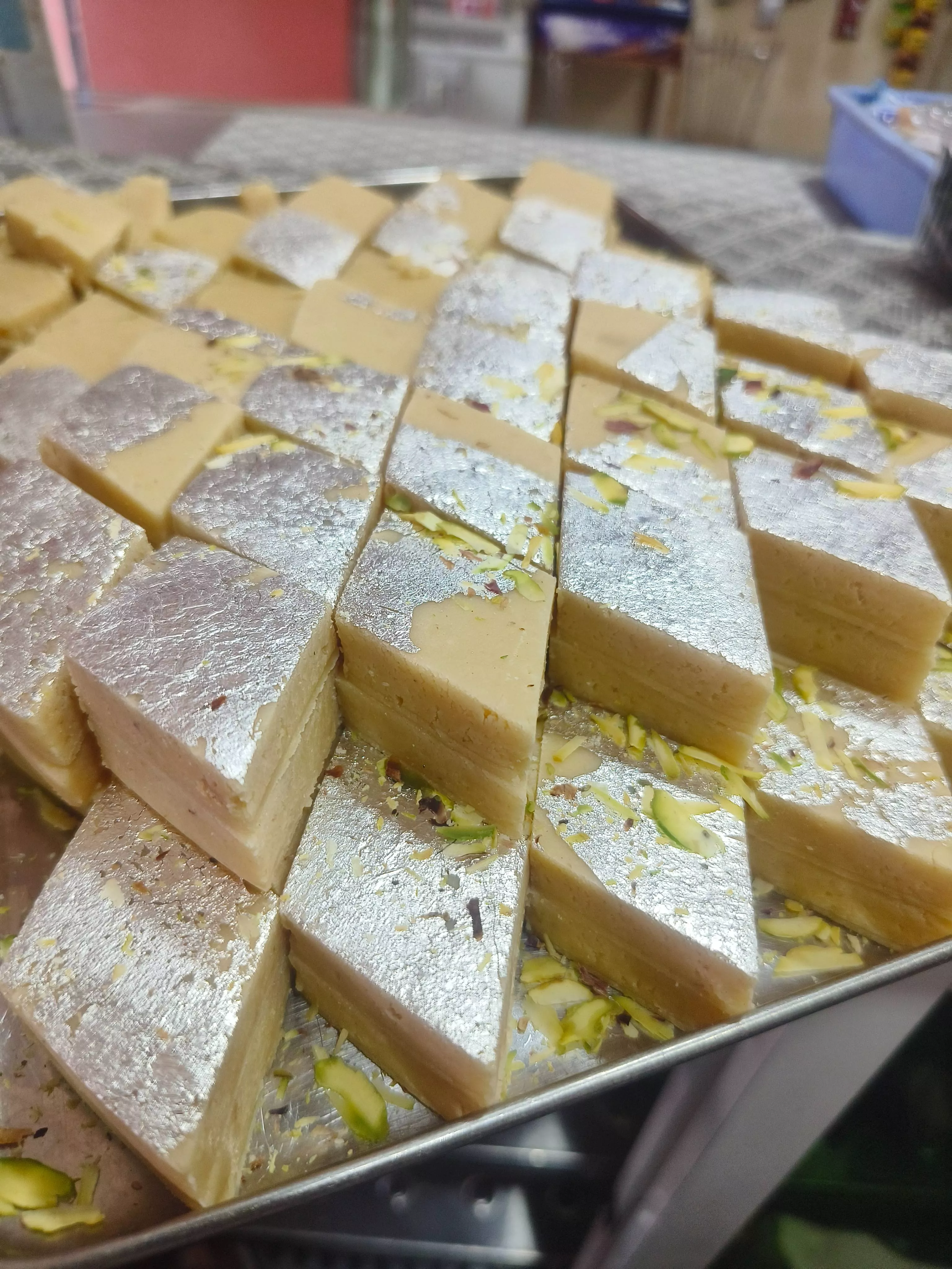 Delicious Malai Katli topped with silver vark from Parteek Sweets in CHICPAWAN, showcasing its rich texture and exquisite pre