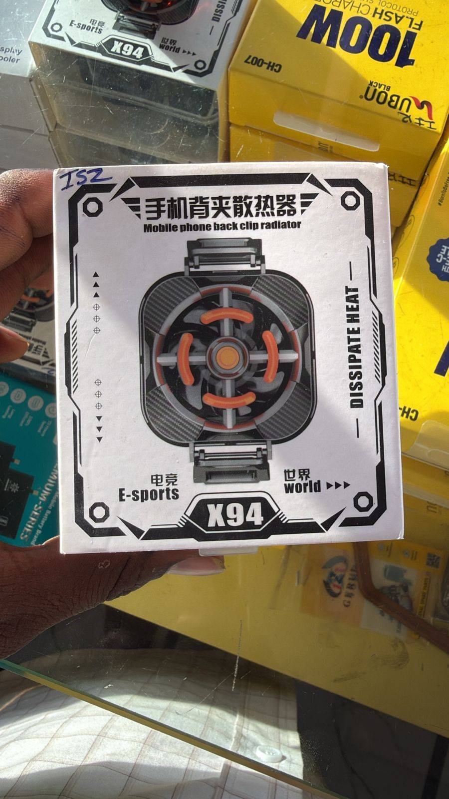 X94 Mobile Phone Back Clip Radiator showcased in MUDAL TITTA, providing cooling for smartphones.