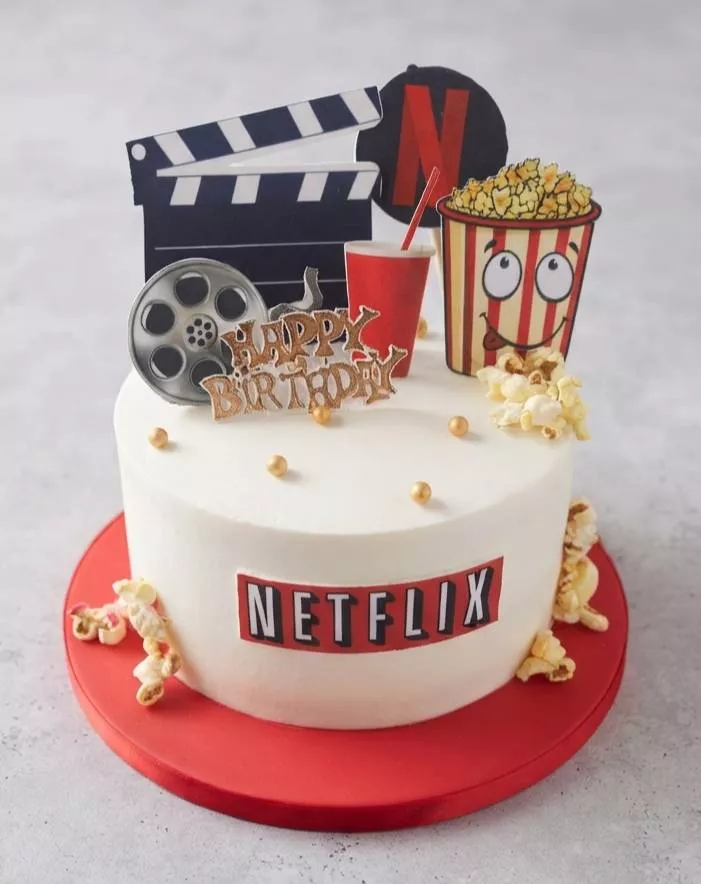 Movie Night Theme Cake from VARNIKA PATISSERIE in Bangalore with cinema-themed decorations