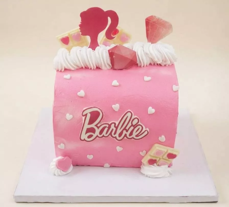Barbie-themed birthday cake with pink frosting from VARNIKA PATISSERIE in Bangalore