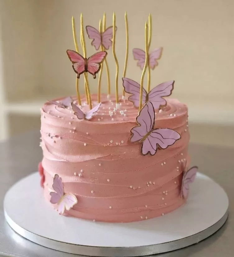 Butterfly Bliss Cake with pink buttercream and butterfly decorations in Bangalore