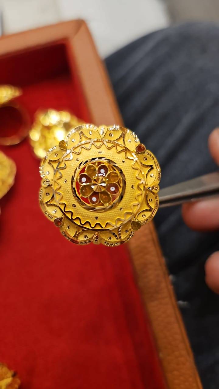 Elegant gold-plated floral brooch displayed in GYANPUR, showcasing intricate design and craftsmanship