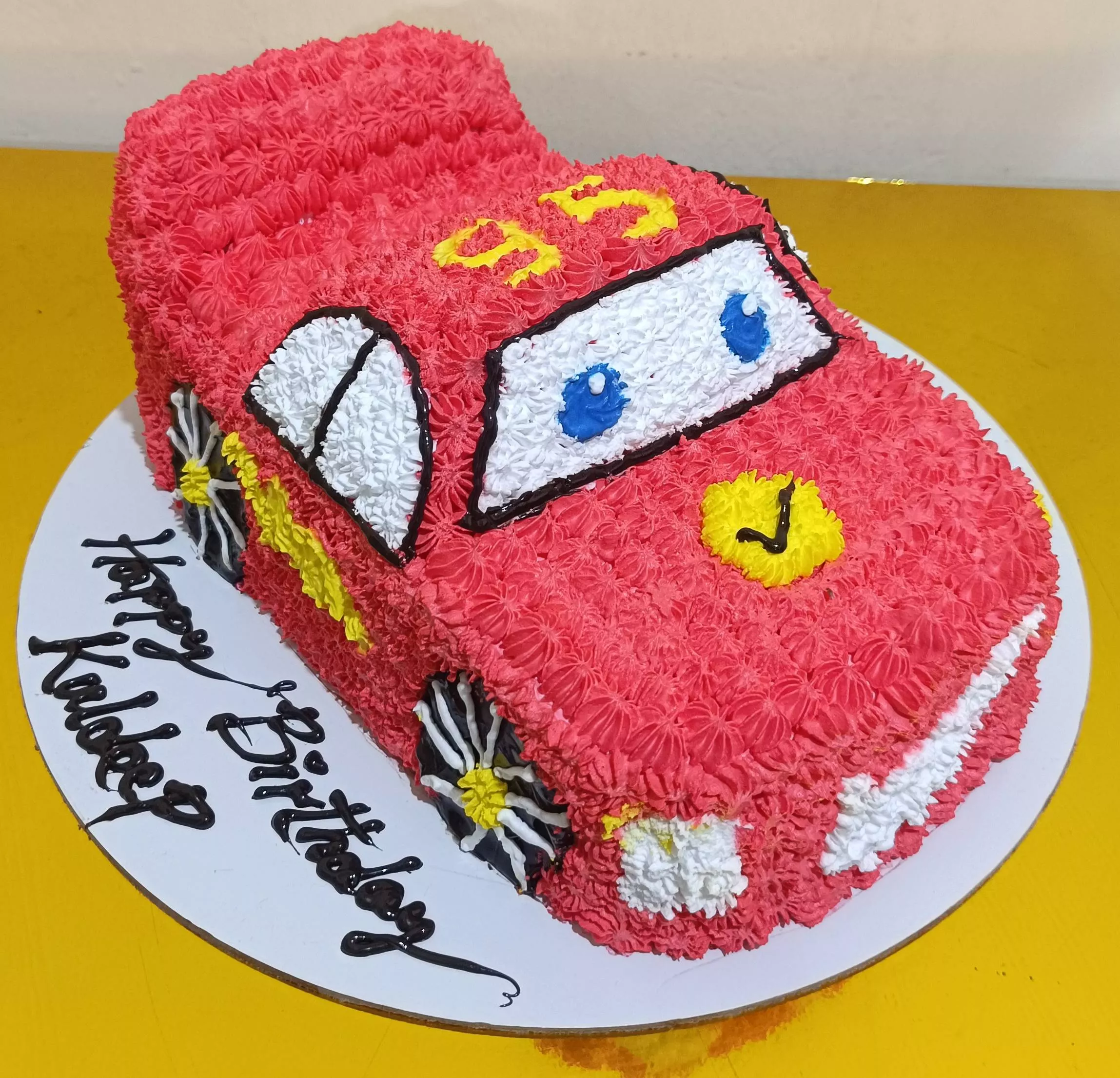 Vibrant car-themed birthday cake designed for kids in Bangalore