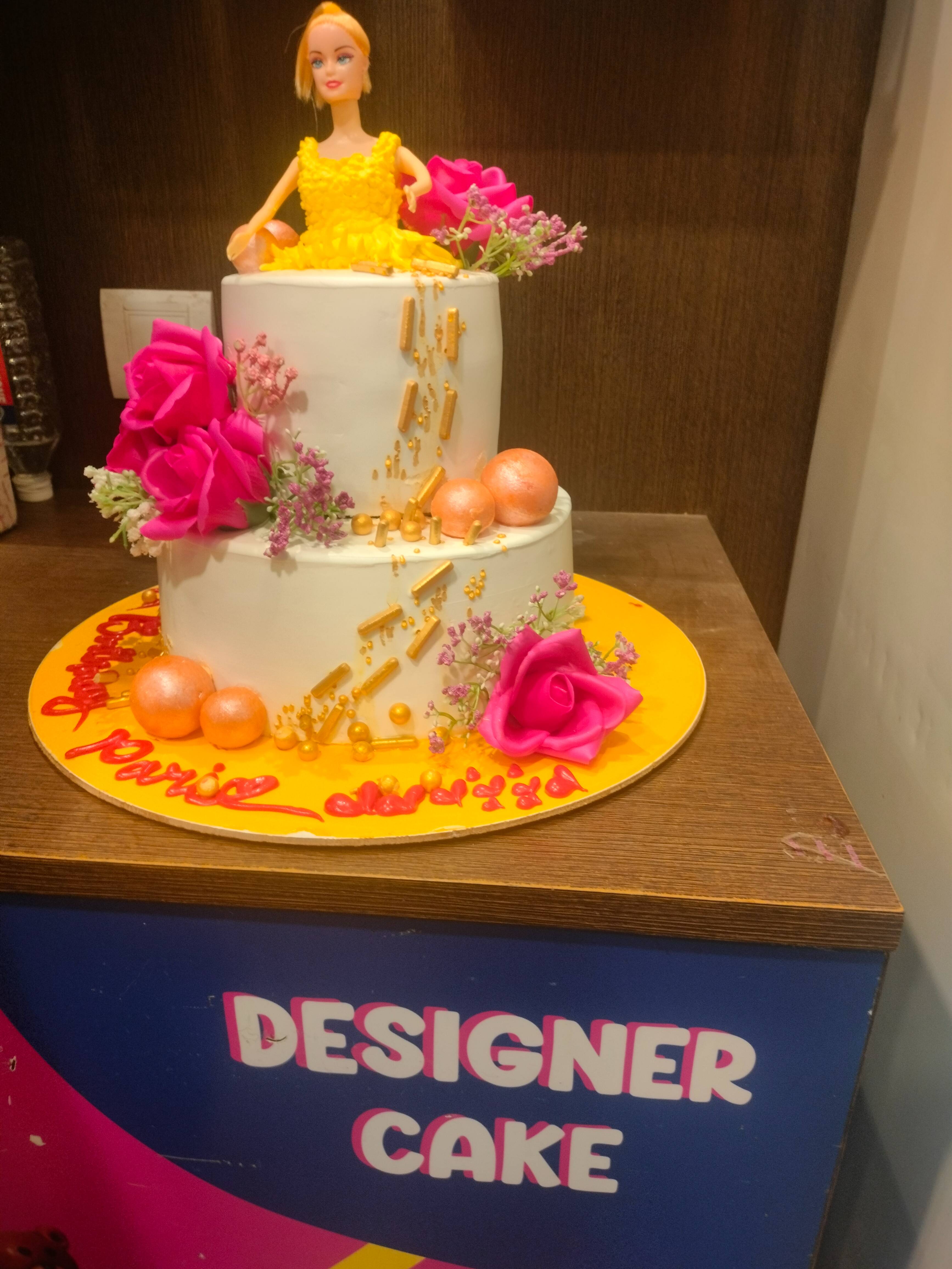 Delicious Monginis Chocolate Doll Cake 3 kg, Mirganj, beautifully decorated for celebrations.
