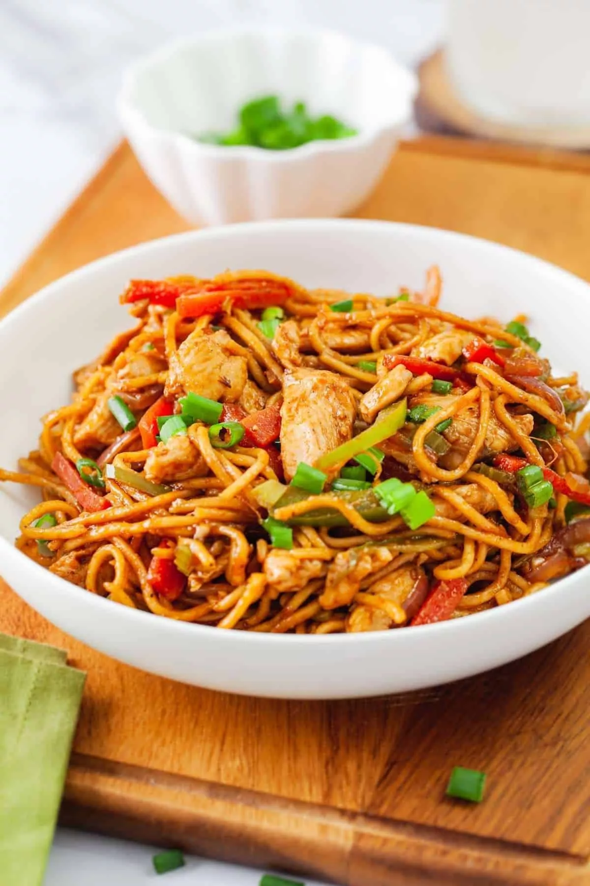 Delicious Egg Chicken Noodles served in a bowl with vegetables in Kolkata
