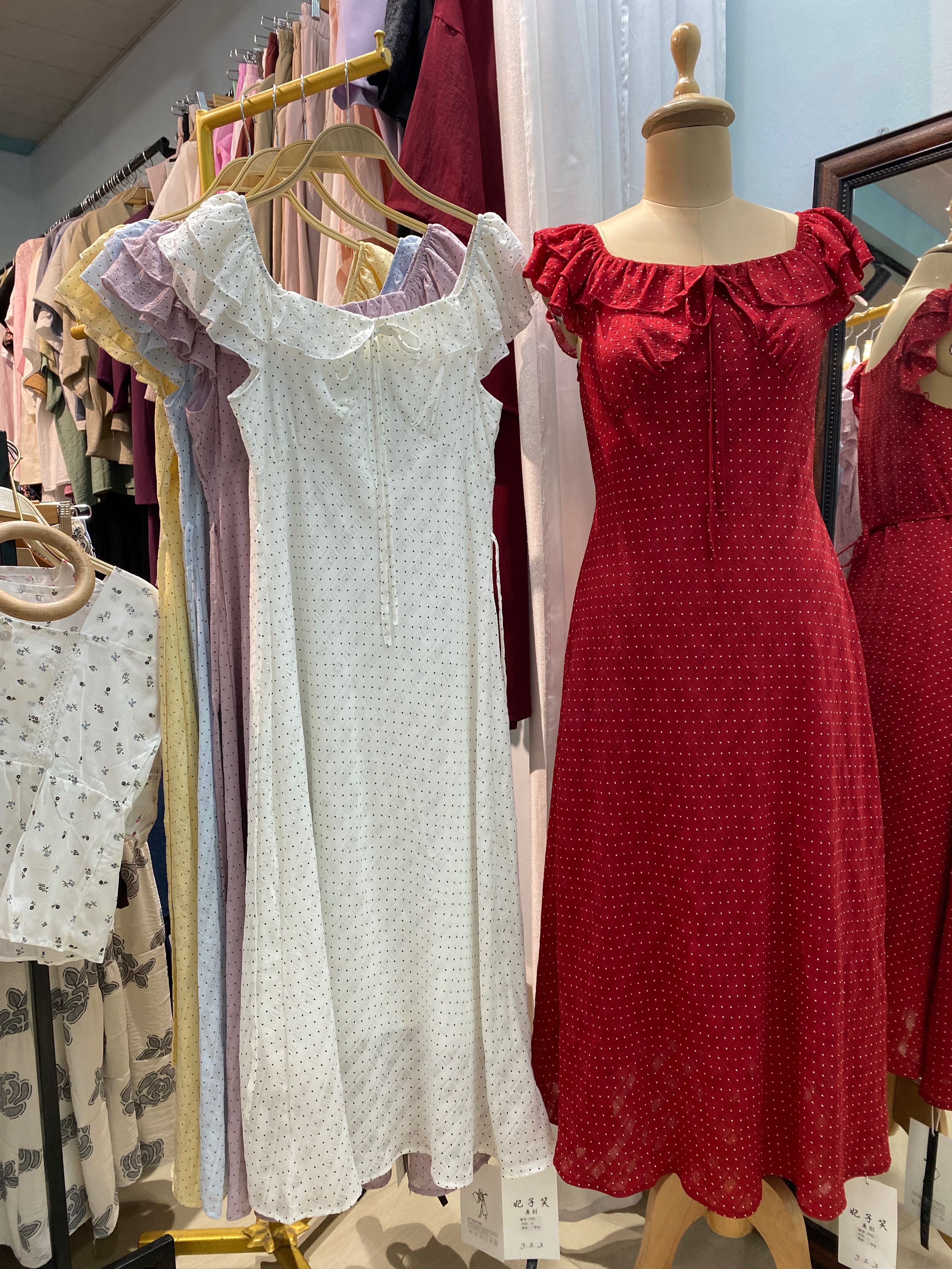 Elegant Polka Dot Dress displayed in RAMHLUN, showcasing stylish design.