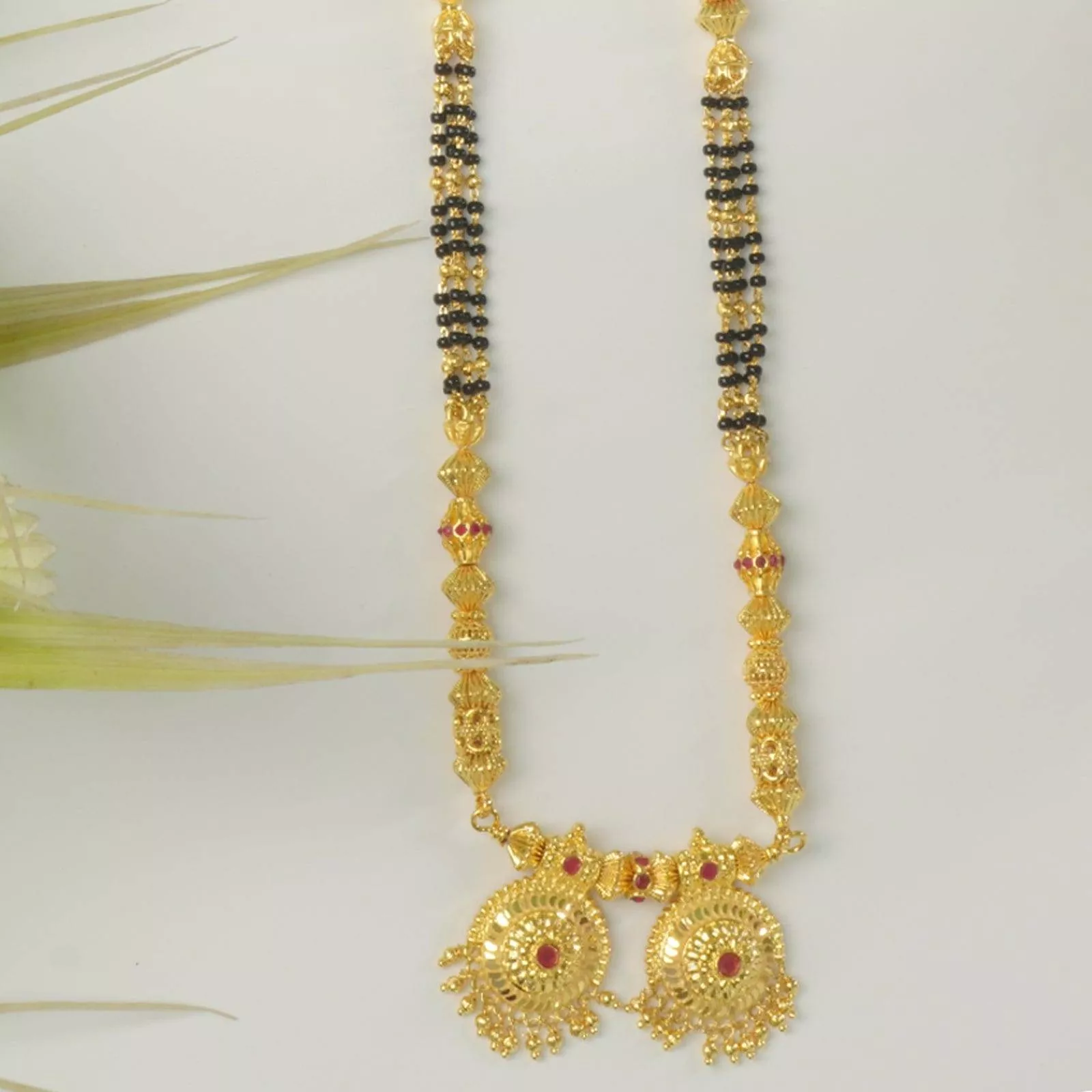 Elegant Ghantan Gold Jewelry showcased in Pune, featuring intricate designs and high-quality gold.